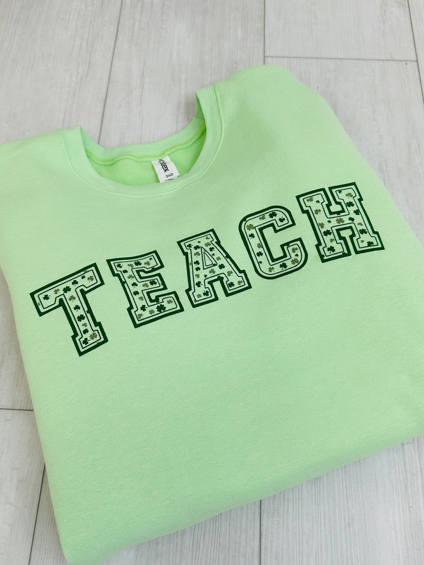 Teach with Clovers Graphic Crewneck Sweatshirt