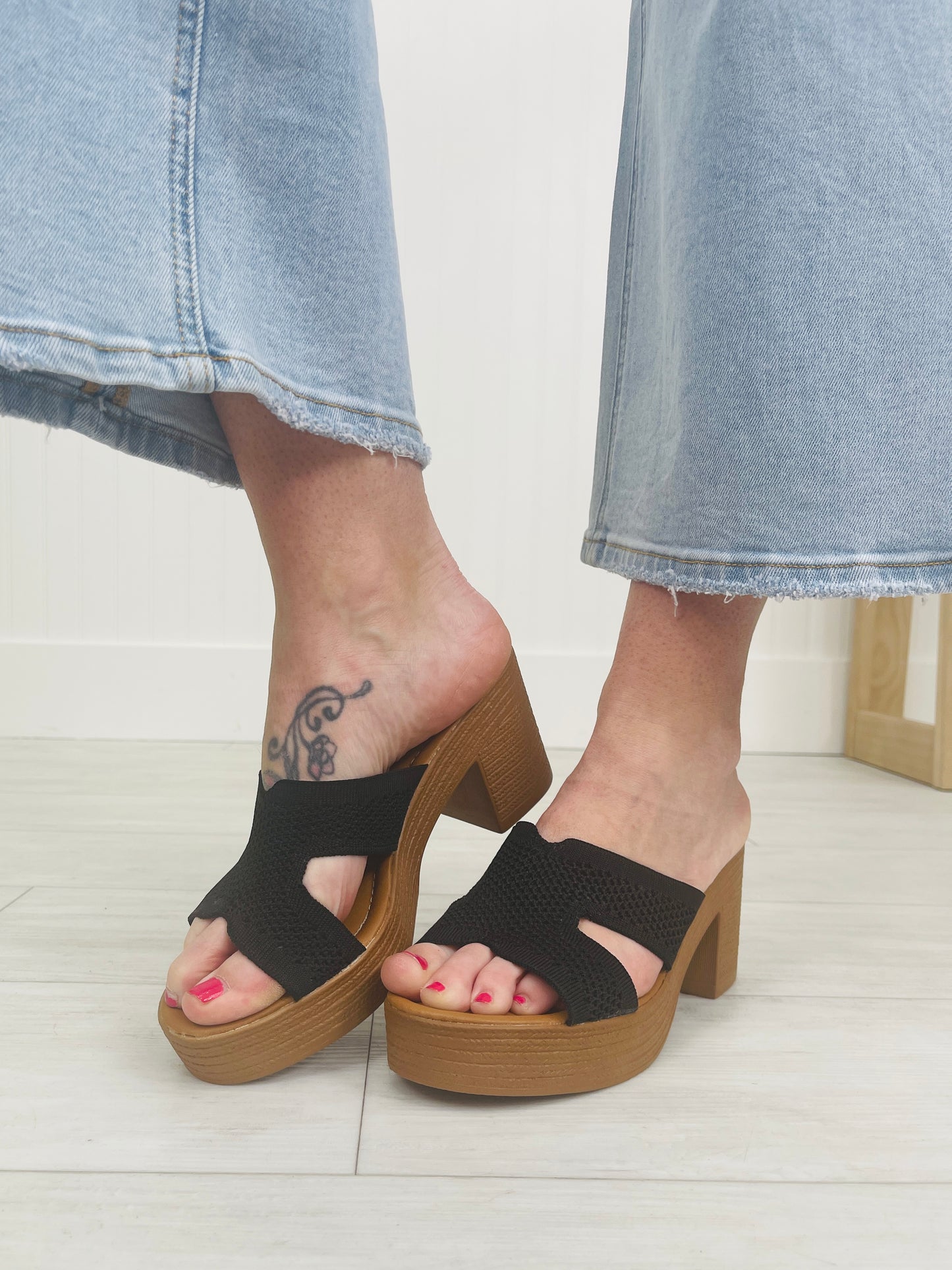 The Cross Over Heeled Mules In Black