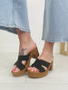 The Cross Over Heeled Mules In Black