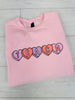 Teach Candy Hearts Graphic Crewneck Sweatshirt